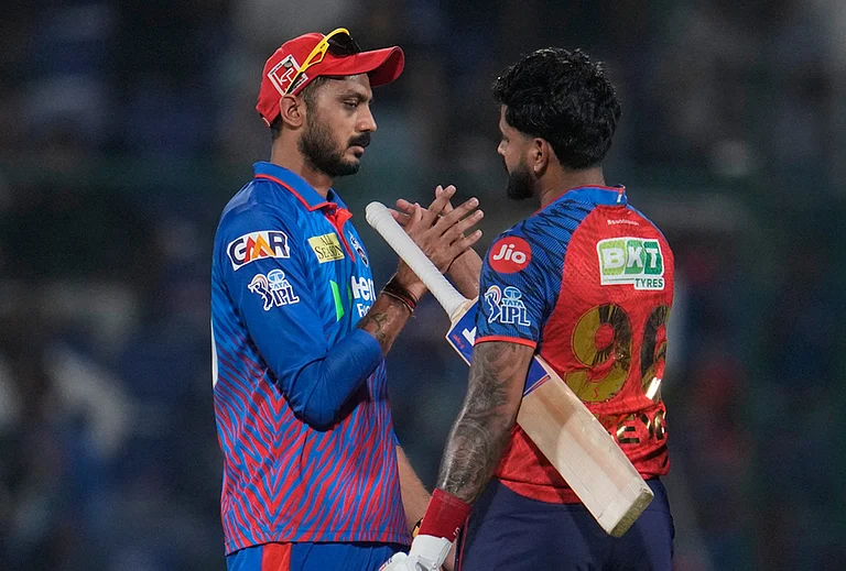 Delhi Capitals' captain Axar Patel, left, congratulates Punjab Kings' captain Shreyas Iyer after Punjab Kings win the Indian Premier League cricket match between Delhi Capitals and Punjab Kings in New Delhi. - | Photo: AP/Manish Swarup