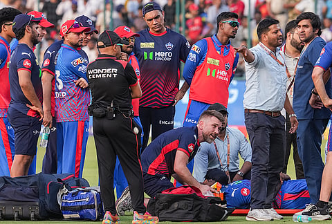 Delhi Capitals' Lungi Ngidi being attended to after facing an injury during the Indian Premier League (IPL) 2026 T20 cricket match between Delhi Capitals and Punjab Kings, in New Delhi.