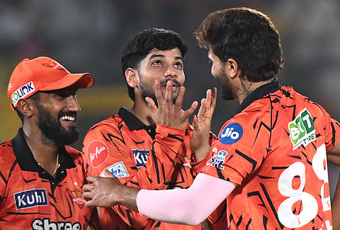 Sunrisers Hyderabad's Nitish Kumar Reddy celebrates the wicket of Rajasthan Royals' Dhruv Jurel with teammates during the Indian Premier League cricket match between Rajasthan Royals and Sunrisers Hyderabad in Jaipur.