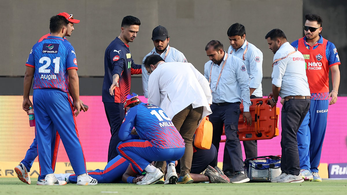 IPL/X : Lungi Ngidi receiving treatment inside the field after suffering head injury during the DC vs PBKS match while taking a catch. 