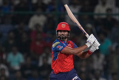 Punjab Kings' captain Shreyas Iyer hits a boundary during the Indian Premier League cricket match between Delhi Capitals and Punjab Kings in New Delhi.