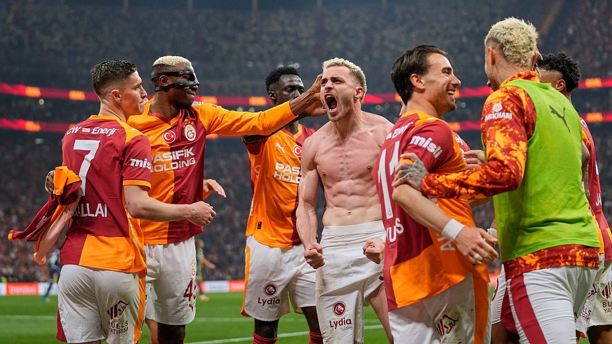 Galatasaray's Baris Yilmaz, center, celebrates with teammates after scoring his side's second goal during a Turkish Super Lig soccer match between Galatasaray and Fenerbahce in Istanbul, Turkey, Sunday. - AP Photo