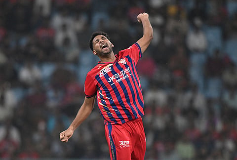 Lucknow Super Giants' Mohsin Khan, left, celebrates the wicket of Kolkata Knight Riders' Rovman Powell during the Indian Premier League cricket match between Kolkata Knight Riders and Lucknow Super Giants in Lucknow.