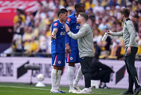 Chelsea's interim manager Calum McFarlane speaks with Chelsea's Enzo Fernandez during the FA Cup semifinal soccer match between Chelsea and Leeds in London, England.