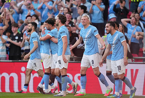 Manchester City players celebrate after scoring during the FA Cup semifinal soccer match between Manchester City and Southampton in Manchester, England.