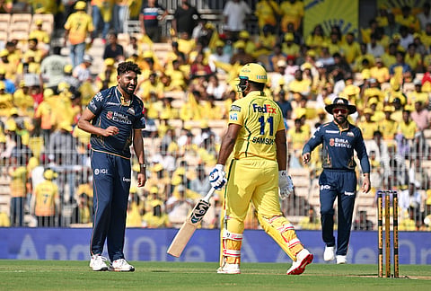 Gujarat Titans' Mohammed Siraj, left, exchanges a friendly word with Chennai Super Kings' Sanju Samson during the Indian Premier League cricket match between Chennai Super Kings and Gujarat Titans in Chennai.