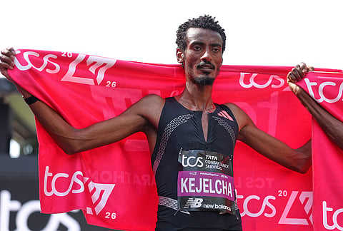 Yomif Keyelcha of Ethiopia celebrates after the men's race at the London Marathon in London.