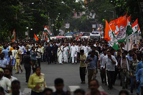 West Bengal Chief Minister and Trinamool Congress supremo Mamata Banerjee with RJD leader Tejashwi Yadav and others during a roadshow amid the ongoing West Bengal Assembly elections, in Kolkata.