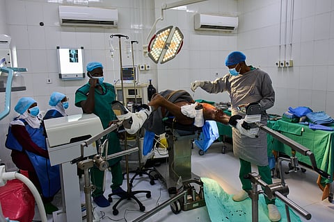 Dr. Jamal Eltaeb operates a patient at Al Nao Hospital in Omdurman, on the outskirts of Khartoum