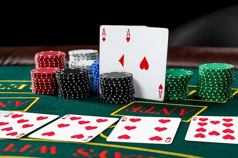Two Aces and stacks of colorful gambling chips - null