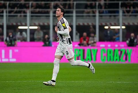 Juventus's Dusan Vlahovic in action during the Serie A soccer match between AC Milan and Juventus, in Milan, Italy.
