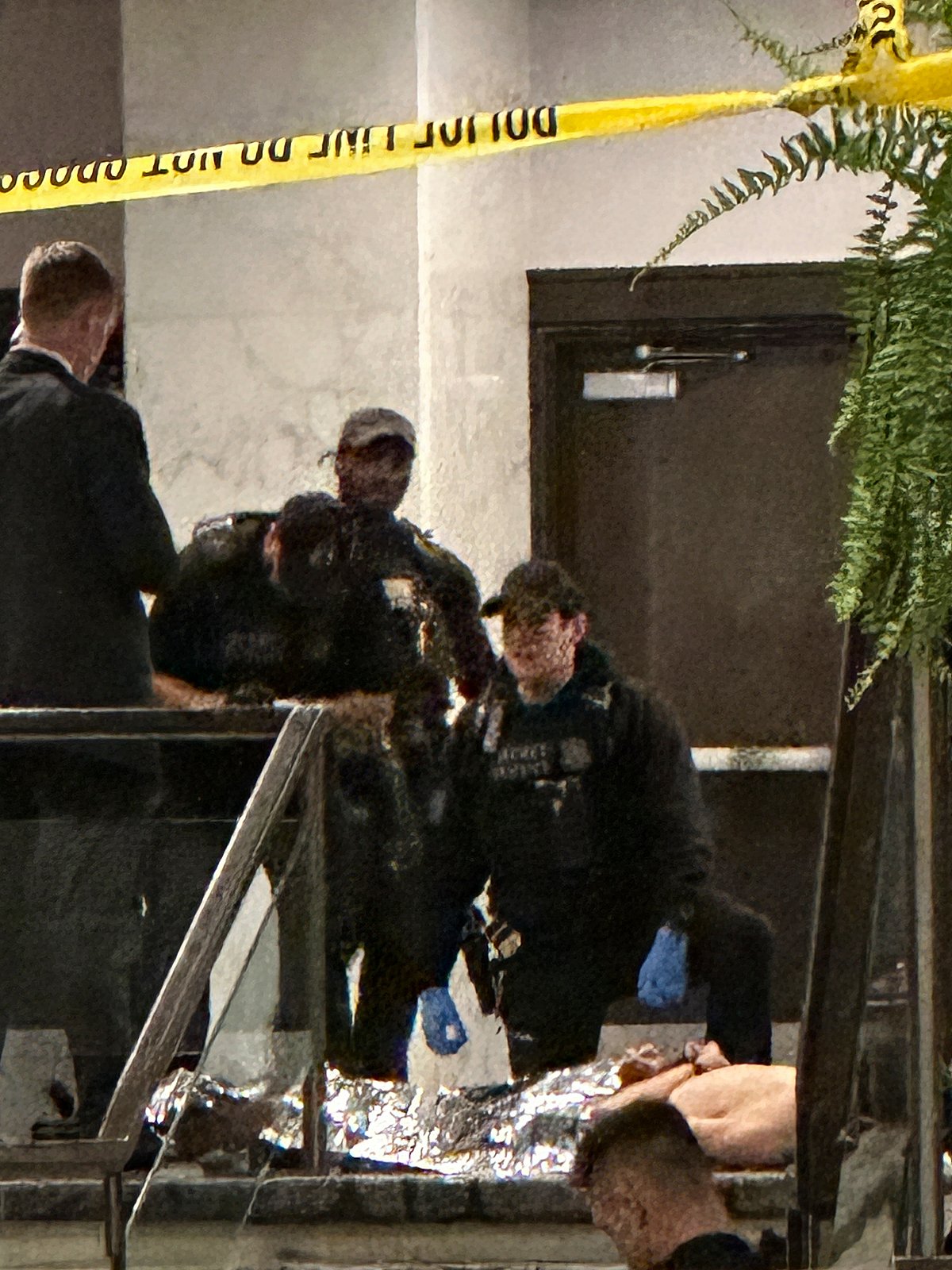 Members of law enforcement control shooting suspect Cole Tomas Allen during the White House Correspondents Dinner, Saturday, April 25, 2026, in Washington.  - (AP Photo/Alex Brandon)
