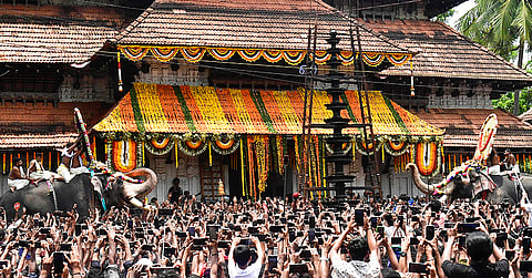 People gather during the conclusion of the 'Thrissur Pooram' festival at the 'Sree Vadakkumnathan Temple', in Thrissur, Kerala.