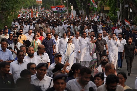 West Bengal Chief Minister and Trinamool Congress supremo Mamata Banerjee with party leaders and workers during a roadshow amid the ongoing West Bengal Assembly elections, in Kolkata.