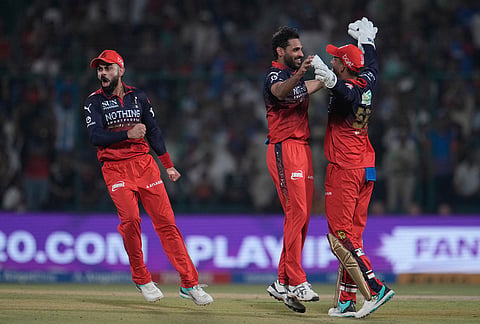 Royal Challengers Bengaluru's Bhuvneshwar Kumar, center, celebrate with teammates the wicket of Delhi Capitals' Tristan Stubbs during the Indian Premier League cricket match between Delhi Capitals and Royal Challengers Bengaluru in Delhi.