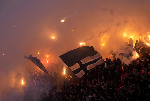 Partizan fans light fireworks during a Serbian National soccer league derby match between Red Star and Partizan in Belgrade, Serbia.