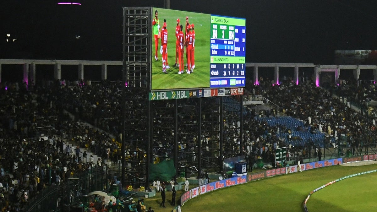 Fans cheer during the Pakistan Super League Qualifier cricket match between Peshawar Zalmi and Islamabad United, in Karachi, Pakistan, Tuesday, - AP Photo