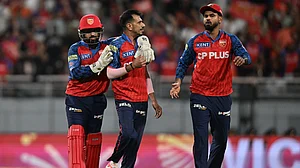 | Photo: AP : Punjab Kings' Yuzvendra Chahal, centre, celebrates with teammates the wicket of Rajasthan Royals' Yashasvi Jaiswal during the Indian Premier League cricket match between Rajasthan Royals and Punjab Kings in New Chandigarh, India, Tuesday, April 28, 2026.