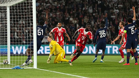 Bayern's Dayot Upamecano, center, reacts after scoring his side's fourth goal during a Champions League semifinal, first leg, soccer match between Paris Saint-Germain and Bayern Munich in Pari