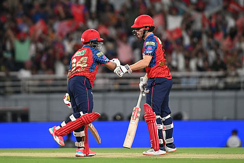 Punjab Kings' Prabhsimran Singh, left, and his batting partner Cooper Connolly celebrates scoring runs during the Indian Premier League cricket match between Rajasthan Royals and Punjab Kings in New Chandigarh, India.