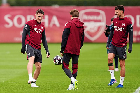 Arsenal's Viktor Gyokeres, left, Martin Odegaard, center, and Ben White during a training session in London.