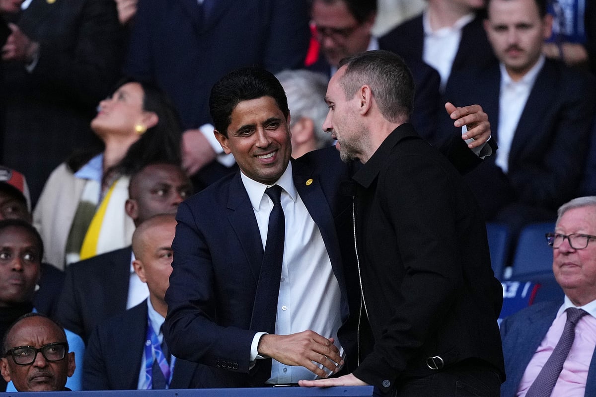 PSG President Nasser Al-Khelaifi, center, on the tribune before a Champions League semifinal, first leg, soccer match between Paris Saint-Germain and Bayern Munich in Paris.