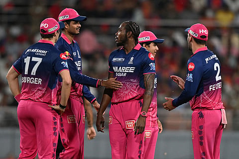 Rajasthan Royals' Jofra Archer, centre, celebrates with teammates the wicket of Punjab Kings' Priyansh Arya during the Indian Premier League cricket match between Rajasthan Royals and Punjab Kings in New Chandigarh, India.
