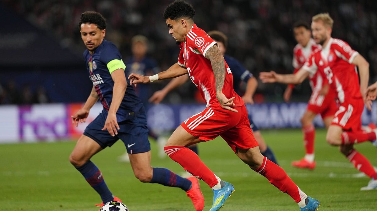 Bayern's Luis Diaz runs with the ball watched by PSG's Marquinhos, left, during a Champions League semifinal, first leg, soccer match between Paris Saint-Germain and Bayern Munich in Paris. - AP Photo