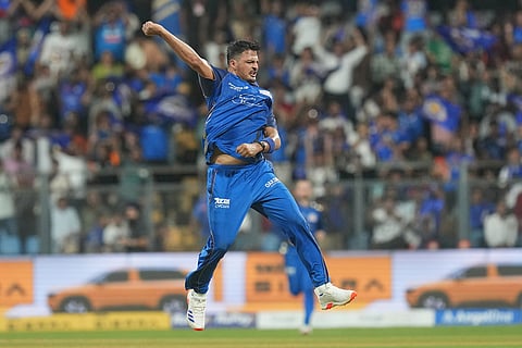 Mumbai Indians' Allah Ghazanfar celebrates the wicket of Sunrisers Hyderabad's Ishan Kishan during the Indian Premier League cricket match between Mumbai Indians and Sunrisers Hyderabad in Mumbai, India.