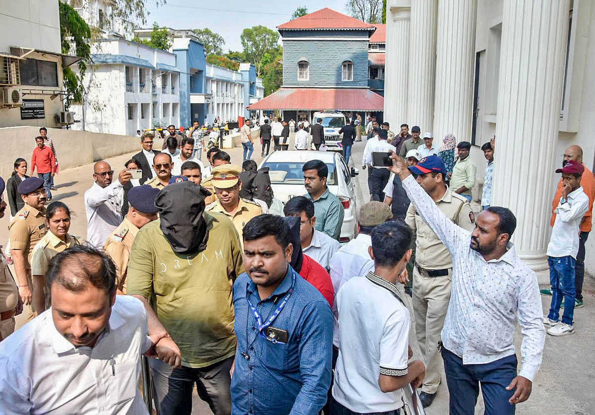 Police escort accused to a court in connection with a case related to the TCS unit, in Nashik, April 24, 2026. - PTI