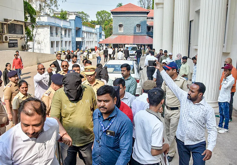 Police escort accused to a court