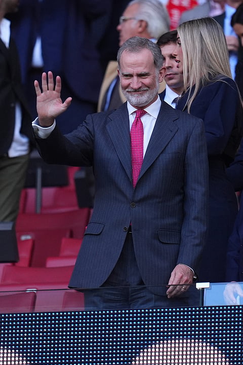 Spain's King Felipe arrives for a Champions League semifinal, first leg, soccer match between Atletico Madrid and Arsenal in Madrid, Spain.