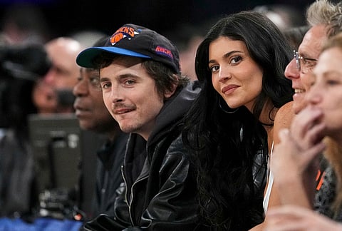 Kylie Jenner, right, and Timothée Chalamet, left, watch during the first half in Game 5 of a first-round NBA playoffs basketball series between the New York Knicks and the Atlanta Hawks, in New York. 