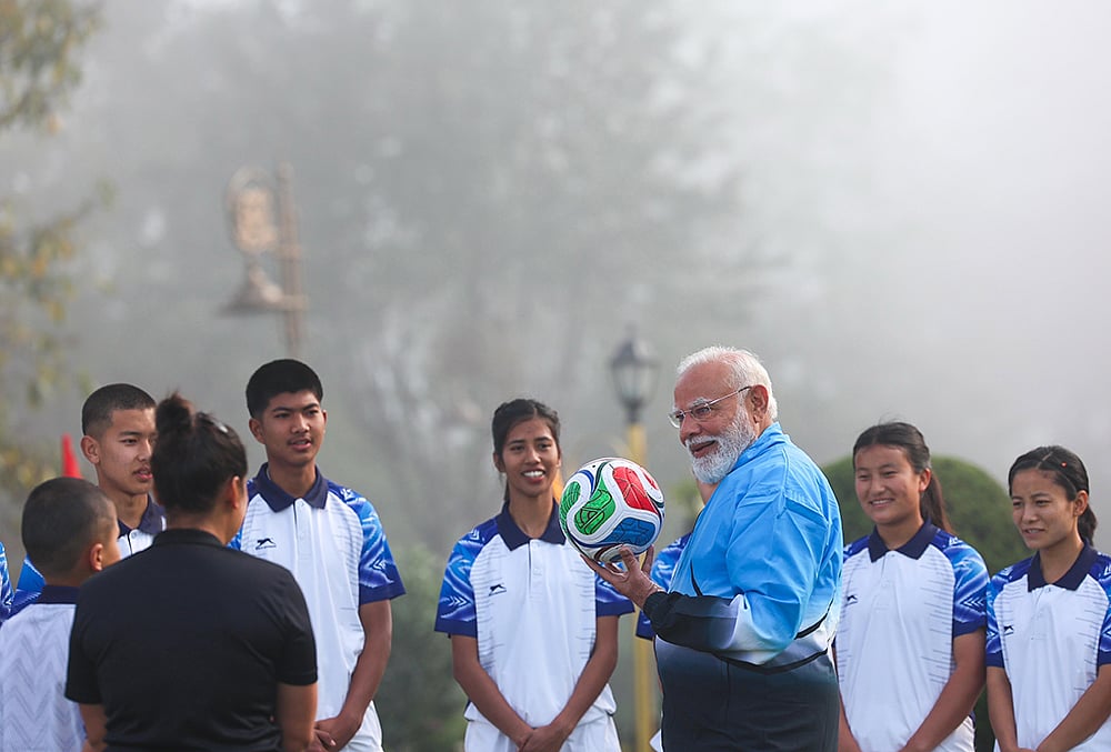 Narendra Modi playing football with kids in Sikkim