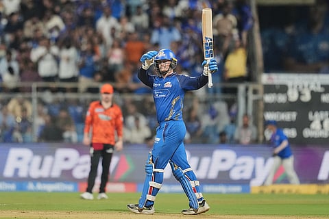 Mumbai Indians' Ryan Rickelton celebrates his fifty runs during the Indian Premier League cricket match between Mumbai Indians and Sunrisers Hyderabad in Mumbai, India