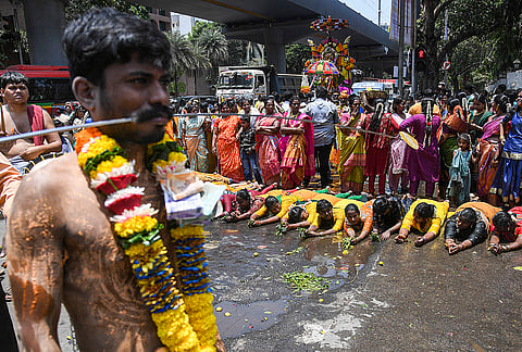 People offer prayers during the 'Mariamman' festival celebration, in Mumbai. The festival is dedicated to the goddess of rain, fertility, and health and is primarily celebrated in Tamil Nadu and Karnataka.