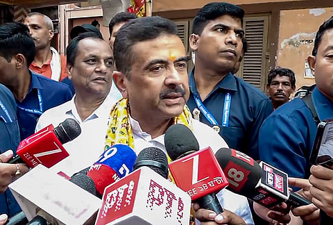 BJP candidate for Nandigram and Bhabanipur constituencies Suvendu Adhikari speaks to the media as he visits Sunder Di Gari to offer prayers during the second and final phase of the West Bengal Assembly elections, at Khidirpur, in Kolkata.