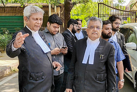 Solicitor General of India (SGI) Tushar Mehta, front right, and Additional Solicitor General (ASG) SV Raju, left, after a hearing in the excise police case at the Delhi High Court, in New Delhi.