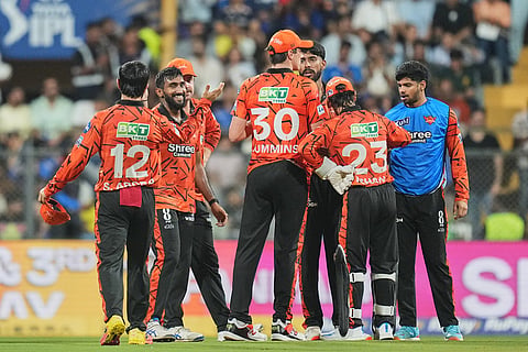 Sunrisers Hyderabad's Eshan Malinga, second left, celebrates with teammates the wicket of Mumbai Indians' Suryakumar Yadav during the Indian Premier League cricket match between Mumbai Indians and Sunrisers Hyderabad in Mumbai, India.