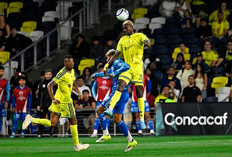 Nashville SC 2026 defender Maxwell Woledzi (3) gets a header over UANL Tigres midfielder Rodrigo Aguirre (17) during the second half of an CONCACAF Champions Cup first leg semifinal soccer match in Nashville, Tennessee.