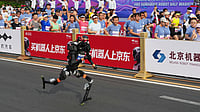 | Photo: AP/Ng Han Guan : A robot starts off for the Beijing E-Town Half Marathon and Humanoid Half Marathon on the outskirts of Beijing.