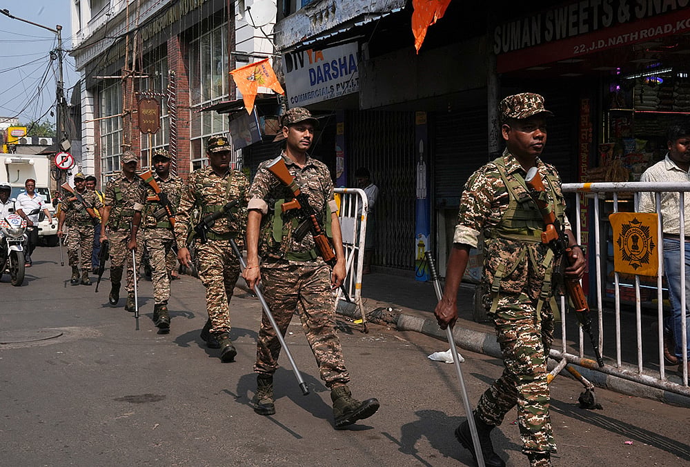 Security personnel conduct a route march 