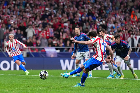 Atletico Madrid's Julian Alvarez shoots to score his sides first goal during a Champions League semifinal, first leg, soccer match between Atletico Madrid and Arsenal in Madrid.