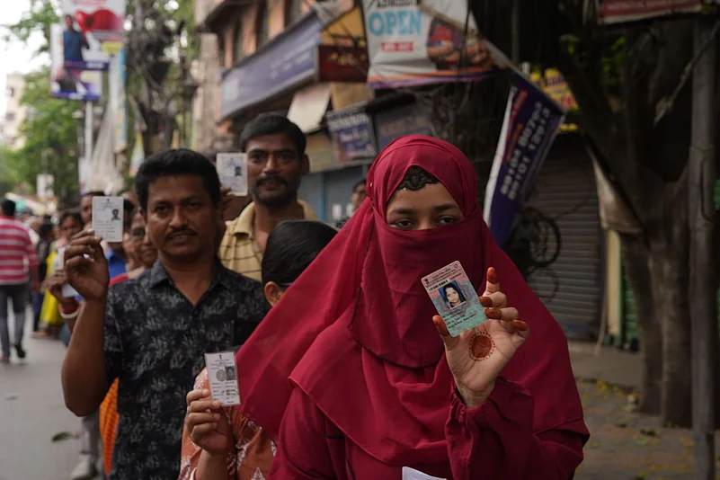 People show their Voter IDs