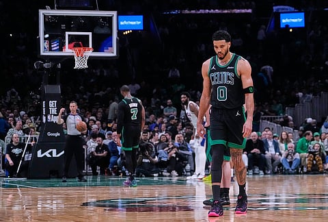 Boston Celtics forward Jayson Tatum (0) heads to the bench while being taken out of the game late the second half while trailing the Philadelphia 76ers in Game 5 of a first-round NBA playoffs basketball series, in Boston.