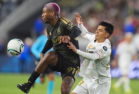 LAFC defender Nkosi Tafari (91) brings down the ball against Toluca midfielder Jorge Diaz (29) during the second half of the first leg of a CONCACAF Champions Cup semifinal soccer match in Los Angeles. 
