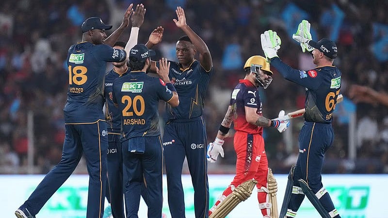 Kagiso Rabada celebrates with teammates the wicket of Virat Kohli during the Indian Premier League match between Gujarat Titans and Royal Challengers Bengaluru in Ahmedabad. - AP