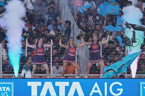 Cheer leaders dance in support to Gujarat Titans during the Indian Premier League cricket match between Gujarat Titans and Royal Challengers Bengaluru in Ahmedabad, India.