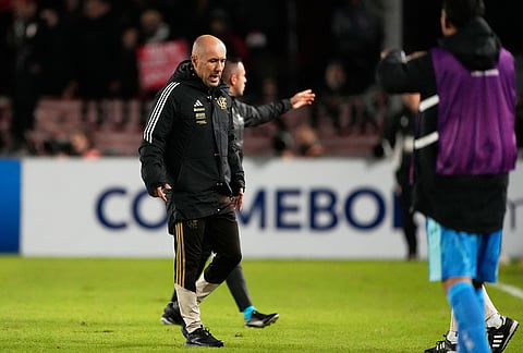 Coach Leonardo Jardim of Brazil's Flamengo, leaves the pitch after receiving a red card during a Copa Libertadores Group A soccer match against Argentina's Estudiantes de La Plata, in La Plata, Argentina.