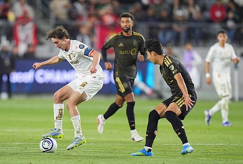LAFC forward Son Heung-Min (7) pressures Toluca midfielder Marcel Ruiz (14) during the second half of the first leg of a CONCACAF Champions Cup semifinal soccer match in Los Angeles.
